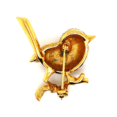 Süße Miniatur-Brosche in Form eines Singvogels. Metall mit Strass-Steinen. Rückseite