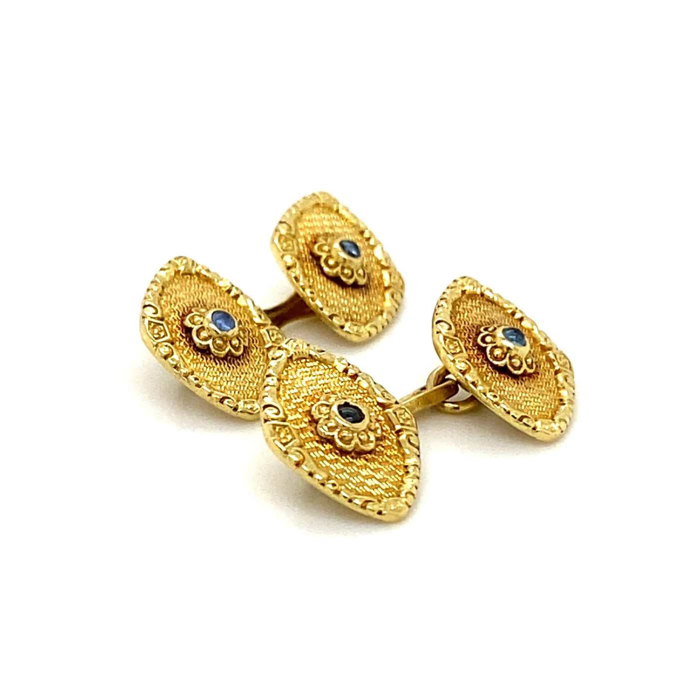 Dekorative, kleine Manschettenknöpfe aus Gold mit kleinen Saphiren