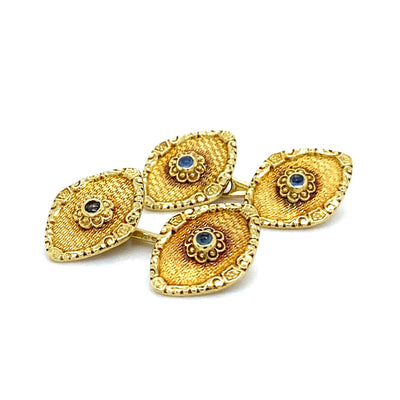 Feine und dekorative Manschettenknöpfe aus Gold mit Saphircabochons
