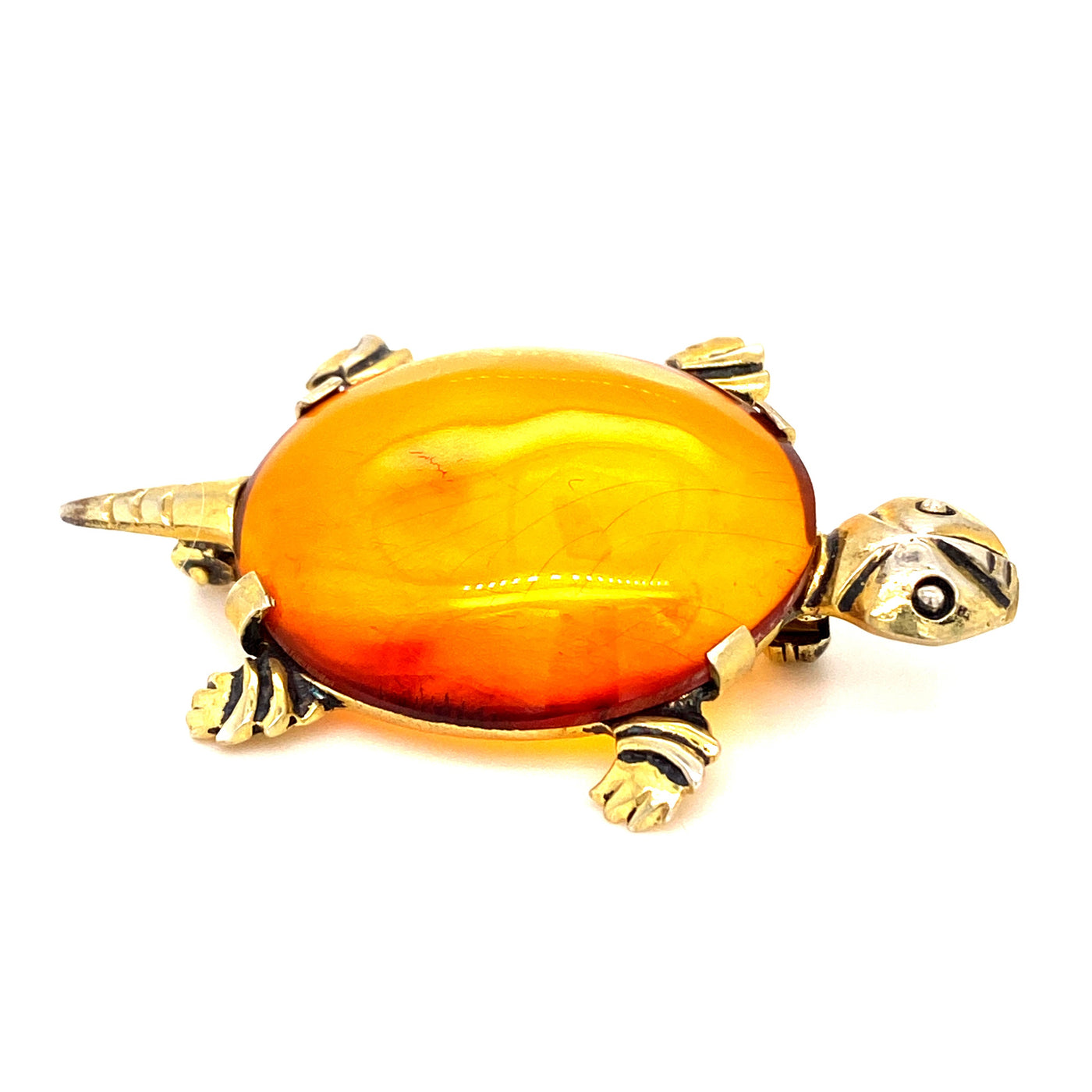 Schildkrötenbrosche mit bernsteinfarbigem Schmuckstein. 